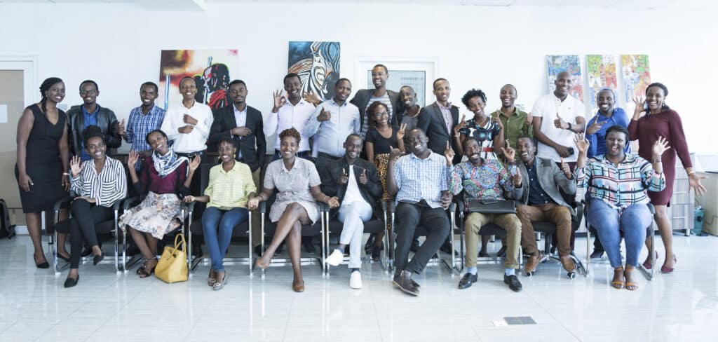 A group of Rwandan adults pose for the camera