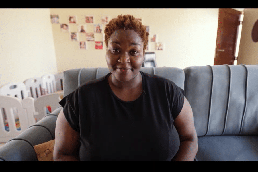 A Tanzanian woman sitting in her living room